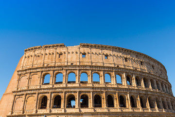 The Colosseum in Rome with blue sky, Italy 