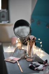 Dressing table with mirror and makeup supplies