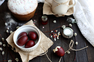 Easter still life with cake on a dark wooden background