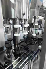 Close-up of bottling and cork machine in red wine production