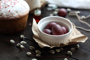 Easter still life with cake on a dark wooden background