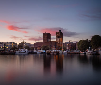 Oslo City Hall during sunset with red clouds behind. Midsummer