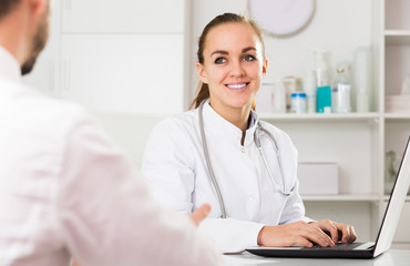 Smiling woman doctor consultation