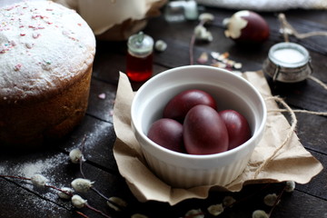 Easter still life with cake on a dark wooden background