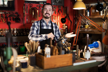 Male worker in leather workshop