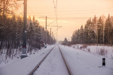 Russian railway in winter. Snow railway. Rails and sleepers.