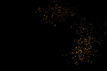 Gold abstract bokeh. Black background. Holyday concept