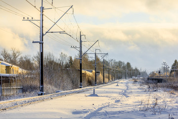 Russian railway in winter. Snow railway. Rails and sleepers.