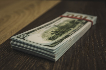 american Dollars banknotes isolated on black background.