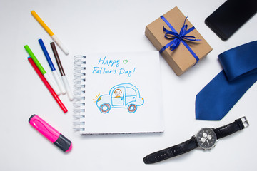 Father's day concept. gift box, tie, funny moustache and child's painting over wooden background. top view, flat lay