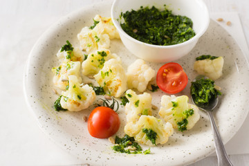 Fried cauliflower with parsley and oil sauce