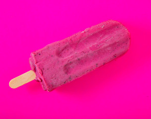 Vibrant ice popsicle  on purple background