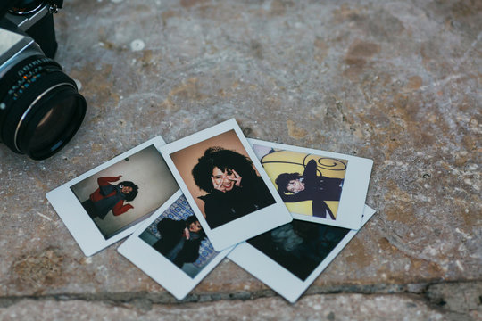 Polaroid Photographs Of Young Woman By Camera