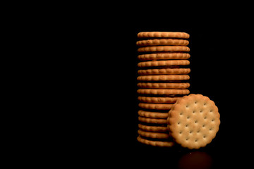 Chocolate Cookies isolated on black background. Tall stack of chocolate chip cookies on black. 