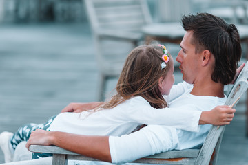 Happy father and his adorable little daughter relax at tropical vacation