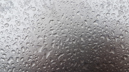 Waterdrops on a grey surface