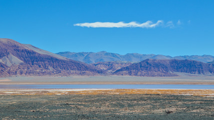 Strange shaped cloud over a lagoon, Puna, Argentina