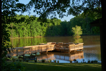   FORT MILL, SOUTH CAROLINA/UNITED STATES – APRIL 27, 2019: Fishing dock on the lake at Anne...