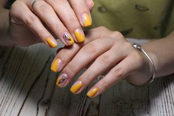 Fototapeta premium Beautiful yellow manicure