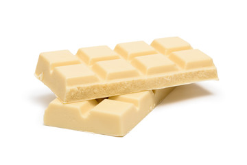 Pieces of white chocolate bar isolated on white background
