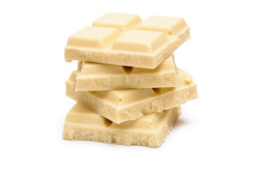 Stack of white chocolate bar pieces isolated on white background
