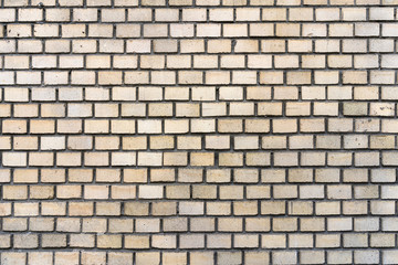 texture is a very smooth brick wall yellow
