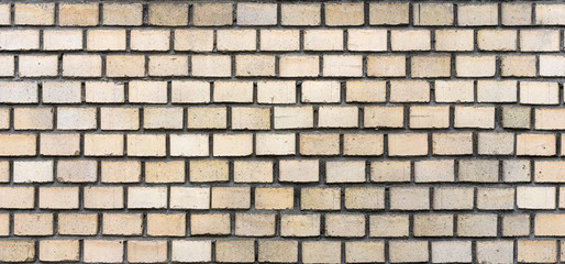 texture is a very smooth brick wall yellow