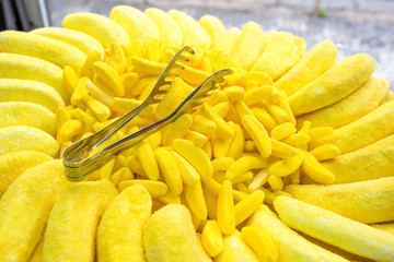 Close up of colorful sweet bright candy pieces shaped like bananas