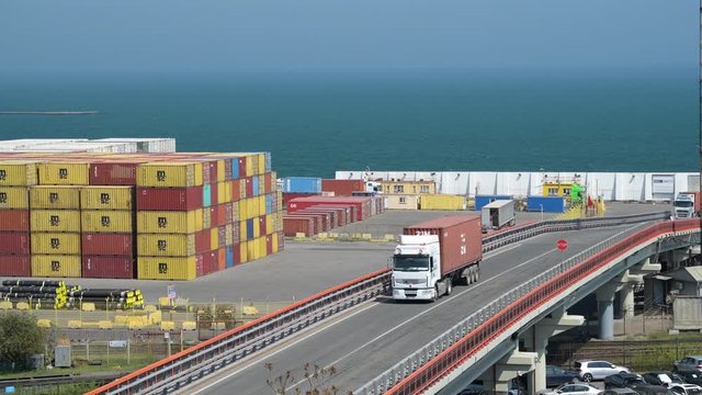 Industrial port in Odessa city, Ukraine, May 4, 2019 - Trucks are going across the industrial seaport