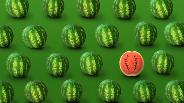 Colorful fruit pattern of fresh watermelons  on green background. Individuality, independence and uniqueness concept. 4k video.