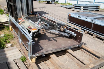 Open car trailer. Trailer store. Assembly of car trailers.