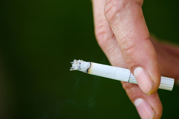 man smoking a cigarette