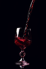 Wine is poured into a glass