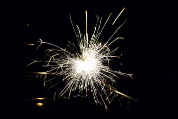 Fototapeta premium Glowing Sparks in the dark