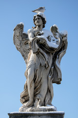 Angel statue in Rome - Italy - in winter with snow