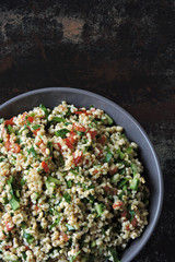 Salad with bulgur, vegetables and parsley. Lemon salad with bulgur. Vegan food.