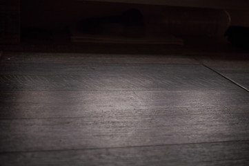 Dark grey background with wooden texture suitable for interior design.