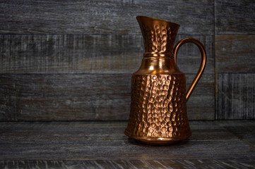 Old ancient antique artistic pitcher container for liquid.