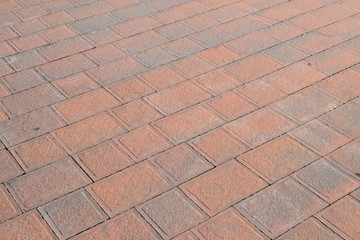 External floor made with cement bricks, used and worn