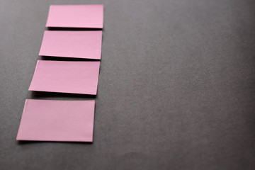 Fototapeta na wymiar pink sheets on a brown background