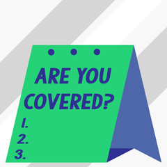 Writing note showing Are You Covered Question. Business concept for asking showing if they had insurance in work or life