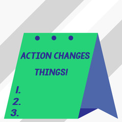 Writing note showing Action Changes Things. Business concept for start doing something against problem resolve or achieve it