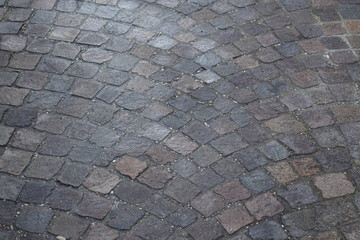 Top view on background texture of straight gray flat stone brick paving stone street street outdoor copyspace, horizontal image