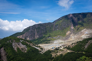 A scenic view of mountain Papandayan with clear blue sky. The view of Tebing Soni and Papandayan Crater. Papandayan Mountain is one of the favorite place to hike on Garut.