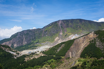 A scenic view of mountain Papandayan with clear blue sky. The view of Tebing Soni and Papandayan Crater. Papandayan Mountain is one of the favorite place to hike on Garut.