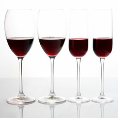 glasses with red wine on a light background