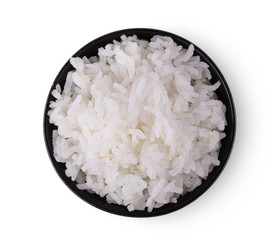 Rice in a black bowl on a white background. top view