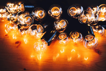glowing bulb uniqueness concept on brown wooden table