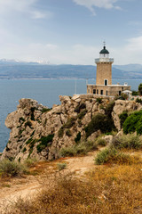 Fototapeta na wymiar The Melagavi lighthouse on the Agrilaos peninsula (Europe, Greece)