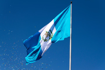 National flag of Guatemala, Central America, to the wind in antler, patriotic symbol, September 12, 1968 current version. Guatemala flag, national symbol, waving on the wind